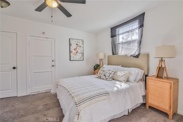 carpeted bedroom featuring a ceiling fan