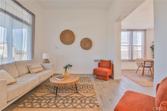 living room with light wood finished floors and baseboards