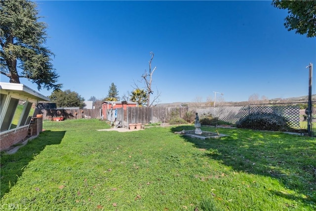 view of yard featuring a fenced backyard