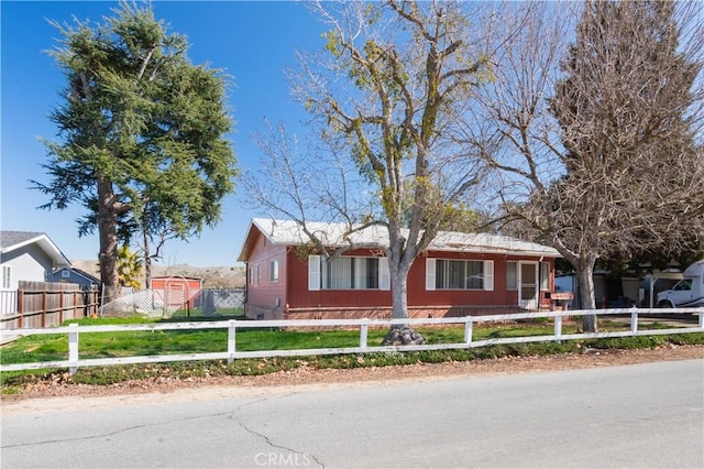 single story home with a fenced front yard