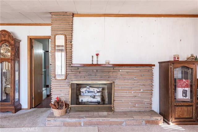 unfurnished living room with carpet floors and a fireplace with raised hearth