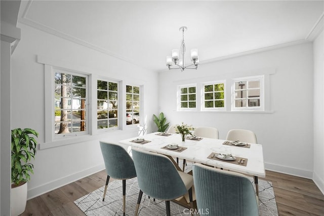 dining area featuring an inviting chandelier, dark wood finished floors, and baseboards