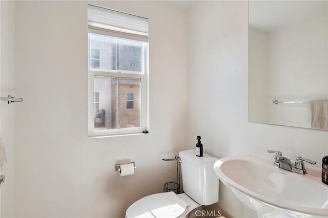 bathroom featuring a sink and toilet