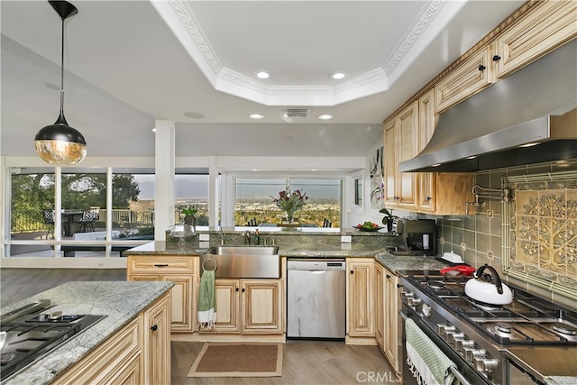 kitchen featuring a raised ceiling, visible vents, stainless steel dishwasher, gas cooktop, and under cabinet range hood