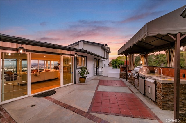 view of patio / terrace featuring a sink and area for grilling