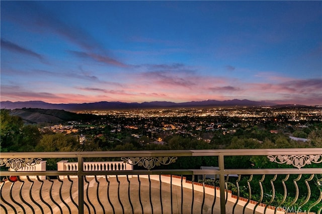 balcony at dusk with a mountain view