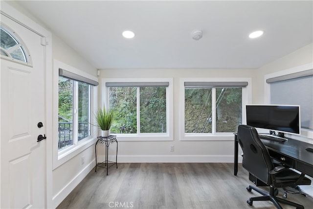 home office featuring recessed lighting, wood finished floors, and baseboards