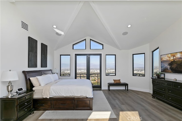 bedroom with high vaulted ceiling, wood finished floors, visible vents, access to exterior, and french doors