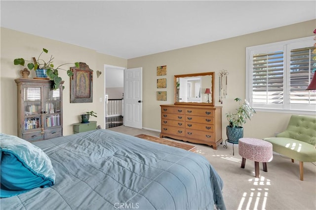 bedroom with light colored carpet