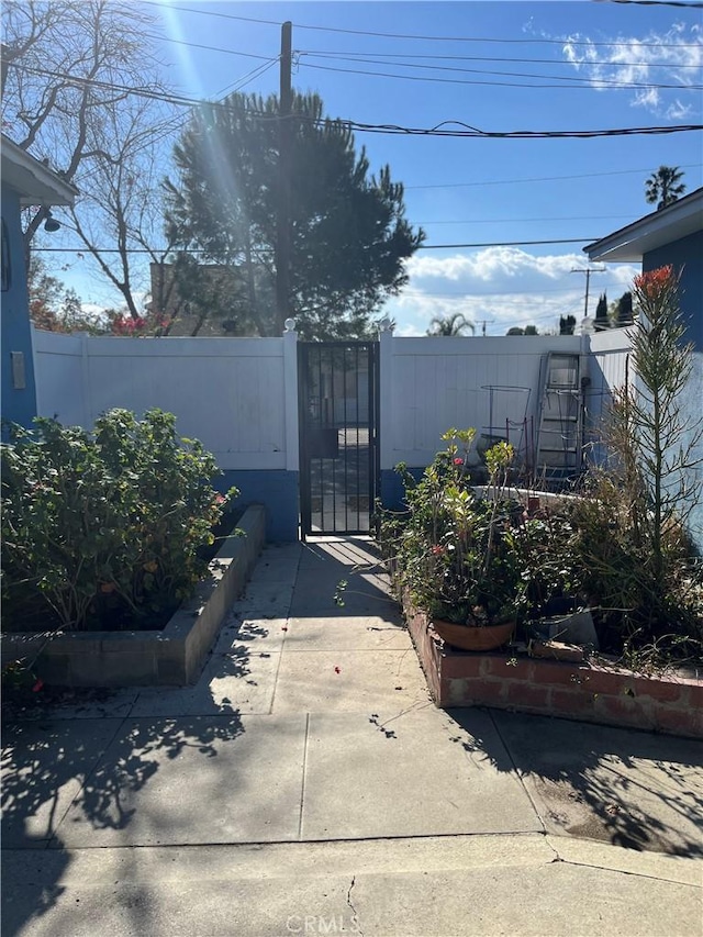 view of gate with fence