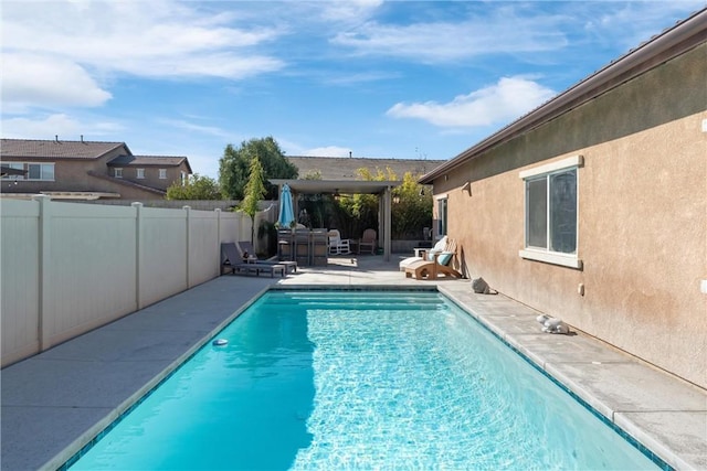 view of swimming pool with a fenced in pool, a patio area, and a fenced backyard