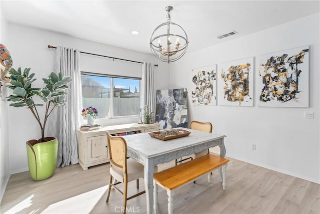 dining room featuring light wood-style floors, visible vents, a chandelier, and recessed lighting