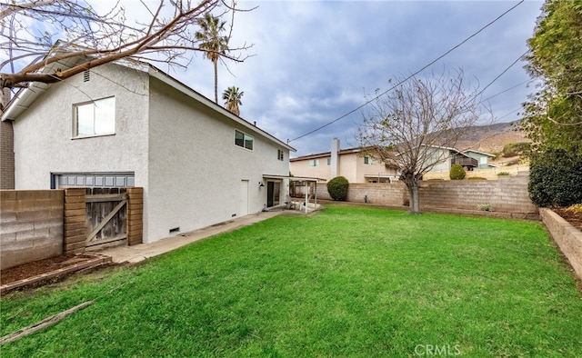 view of yard with a fenced backyard