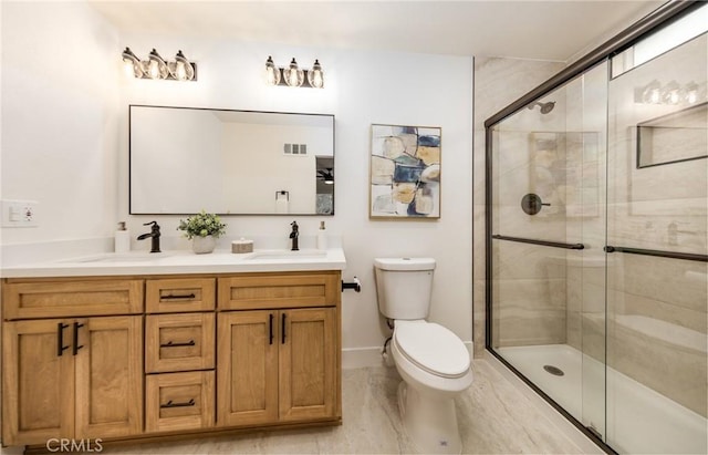 full bath featuring toilet, a stall shower, visible vents, and a sink