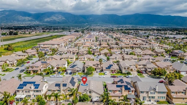 aerial view featuring a mountain view and a residential view