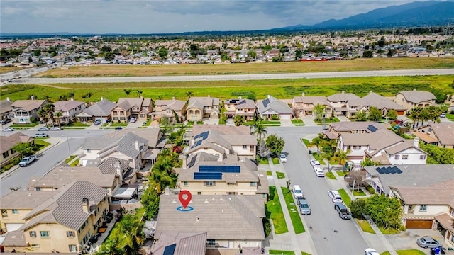 aerial view featuring a mountain view and a residential view