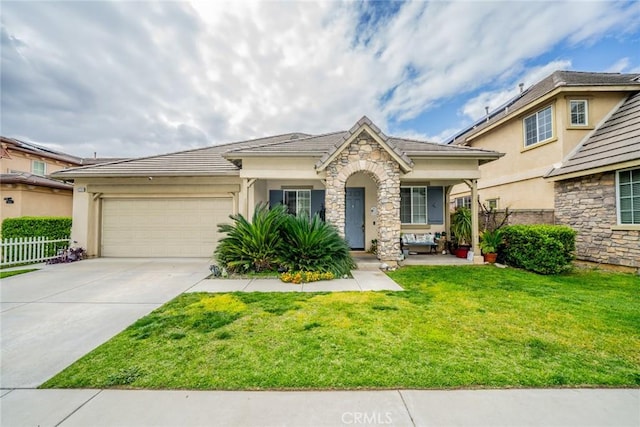 view of front of home with stucco siding, stone siding, fence, concrete driveway, and a garage