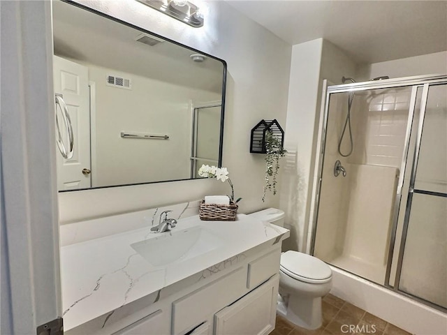 full bathroom with tile patterned floors, visible vents, a stall shower, and toilet