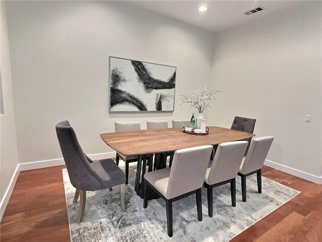 dining room with visible vents, recessed lighting, baseboards, and wood finished floors