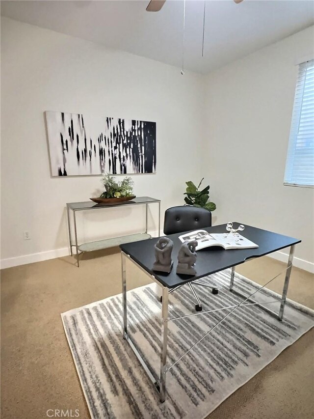 office area with ceiling fan, carpet, and baseboards