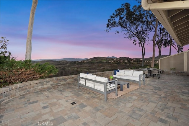 view of patio / terrace with a mountain view and an outdoor living space