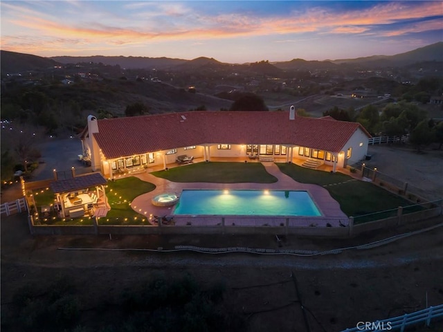 birds eye view of property featuring a mountain view