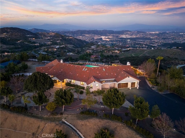 aerial view at dusk with a mountain view