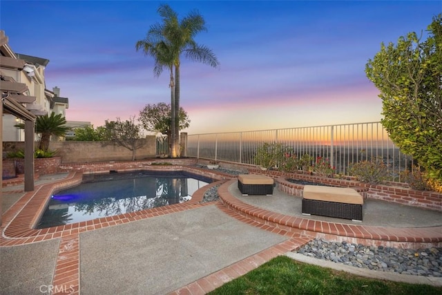 view of swimming pool featuring a patio area, a fenced backyard, and a fenced in pool