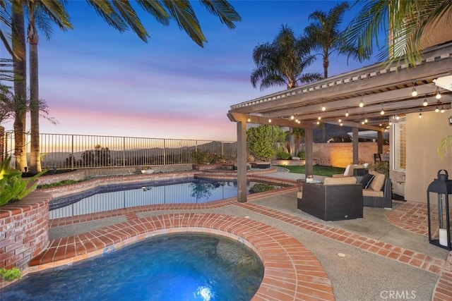 pool at dusk with a fenced in pool, a patio, a fenced backyard, an outdoor hangout area, and an in ground hot tub