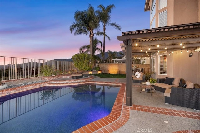 pool at dusk featuring a patio area, a fenced backyard, an outdoor living space, and a fenced in pool