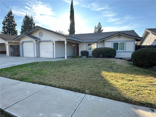 single story home featuring concrete driveway, a front lawn, a garage, and fence