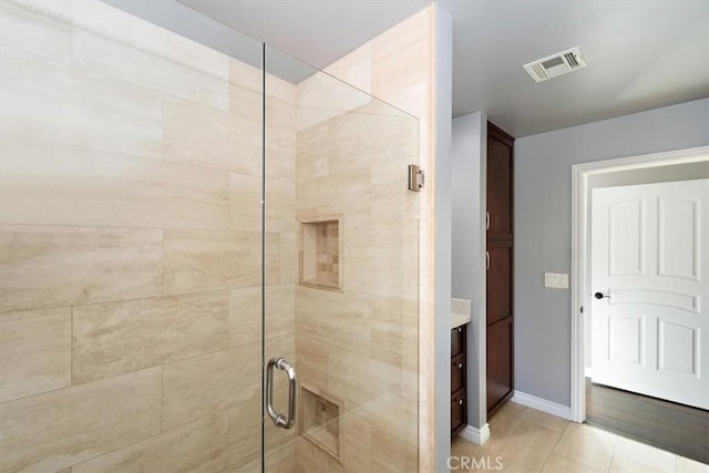 5605 Via, San Jacinto, Riverside, CA 92506 - bathroom featuring visible vents, baseboards, and a stall shower