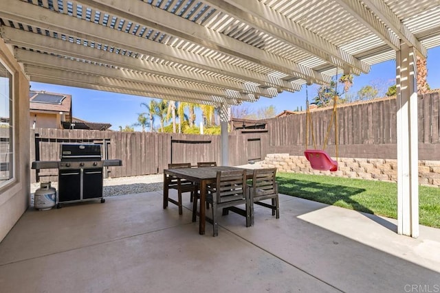 view of patio / terrace with outdoor dining area, a fenced backyard, grilling area, and a pergola