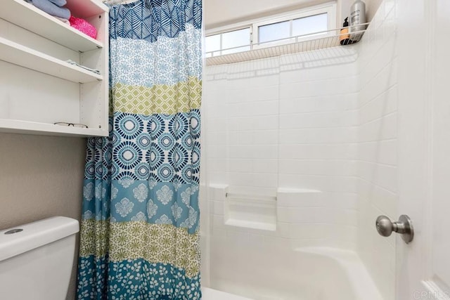 full bath with shower / bath combo with shower curtain and toilet