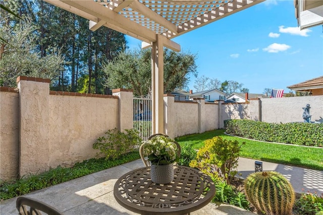 view of patio / terrace with a fenced backyard and a pergola