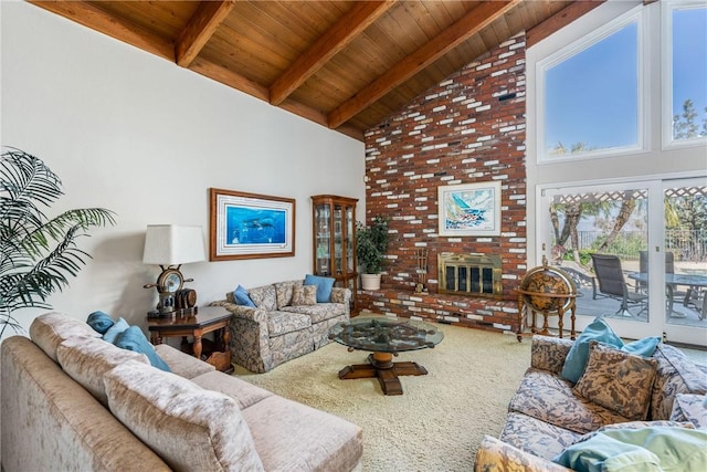 carpeted living area with high vaulted ceiling, wood ceiling, a brick fireplace, and beamed ceiling