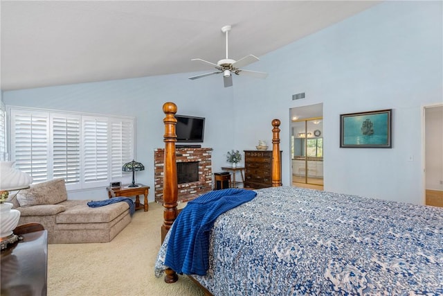 bedroom with light carpet, visible vents, ceiling fan, a fireplace, and high vaulted ceiling