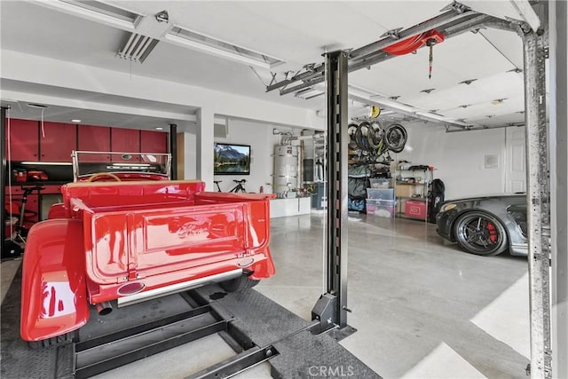 garage featuring secured water heater