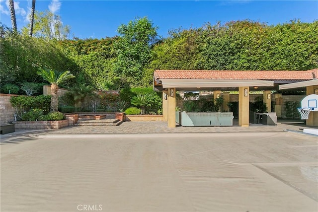 view of property's community with a patio area and fence