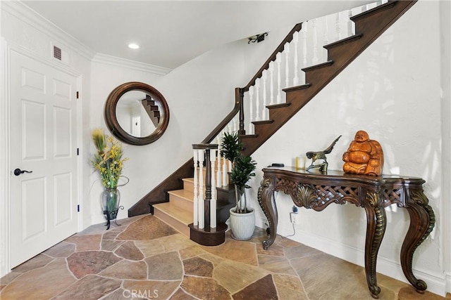 foyer entrance featuring ornamental molding, stairway, stone tile flooring, and recessed lighting