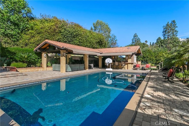 pool featuring a patio area and a gazebo