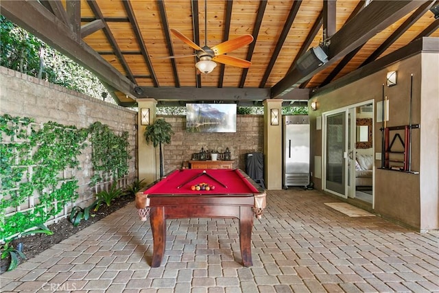 recreation room with a ceiling fan, wooden ceiling, pool table, brick floor, and beam ceiling