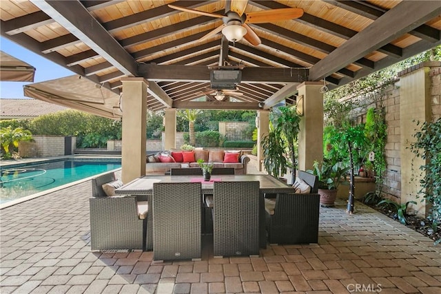 view of patio / terrace with ceiling fan, a fenced backyard, an outdoor hangout area, and a gazebo