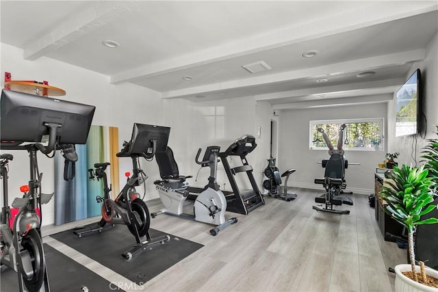 exercise room featuring baseboards, recessed lighting, and light wood-style floors