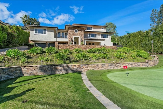 exterior space with stone siding and stucco siding