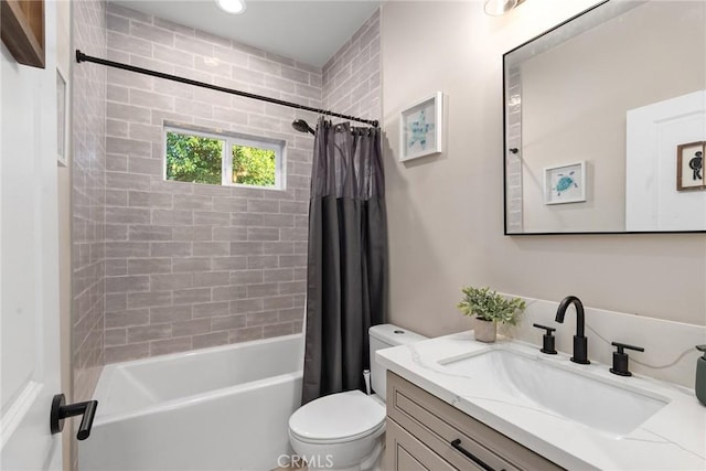 full bathroom with shower / bath combination with curtain, vanity, and toilet