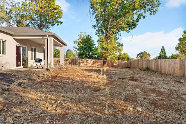 view of yard with a fenced backyard