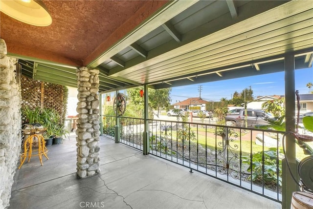 view of patio / terrace featuring a balcony and a residential view