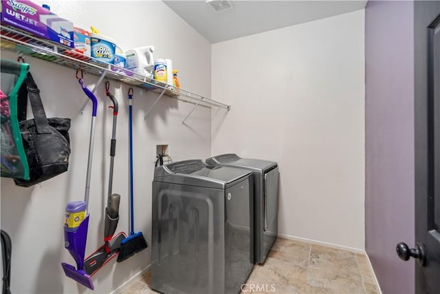 40467 Tiger Way, Palmdale, CA 93551 - clothes washing area featuring separate washer and dryer, laundry area, stone finish floor, and baseboards