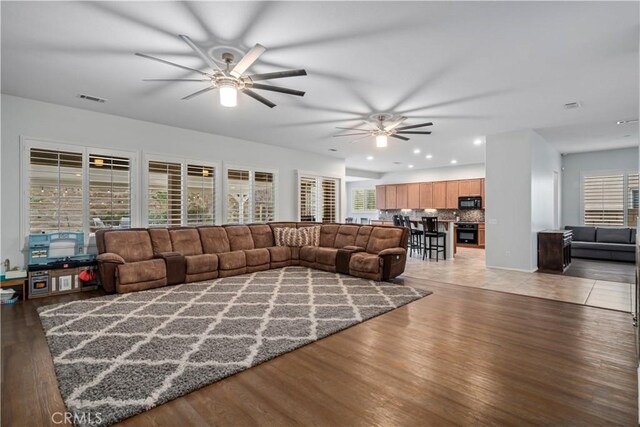 40467 Tiger Way, Palmdale, CA 93551 - living area with ceiling fan, light wood finished floors, recessed lighting, and visible vents